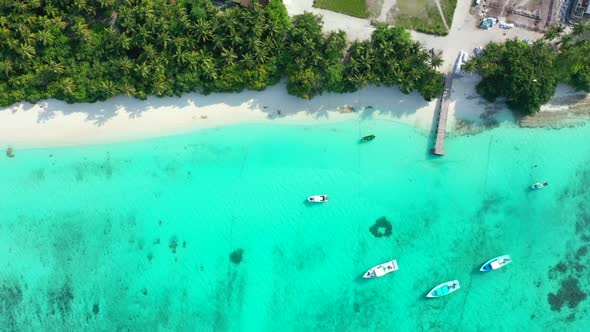 Aerial view nature of tropical seashore beach vacation by clear lagoon with white sand background of