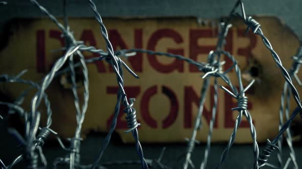 Danger Zone Sign Behind Barbed Wire