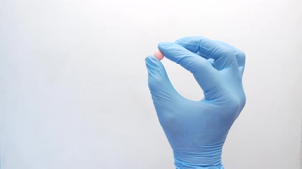 Close Up of Man Hand in Latex Gloves Holding Medical Tablet with Copy Space