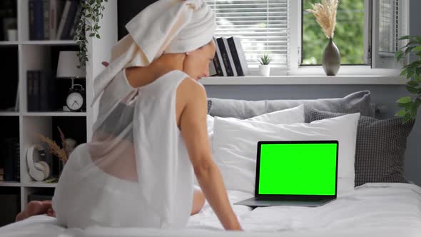 Woman Using Chroma Key Laptop