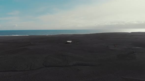 Travelers gathering around crashed airplane