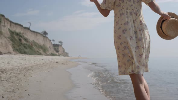 Girl Running Wet Shore in Slow Motion Back View