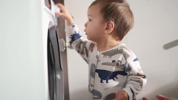 Little Asian boy including washing machine