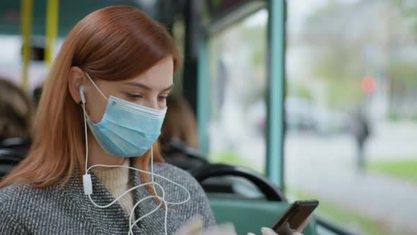 Girl Wearing Medical Mask and Gloves To Protect Against Virus and Infection Rides Bus During