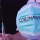 Coronavirus epidemic concept. Doctor holding syringe with COVID-19 vaccine. - VideoHive Item for Sale
