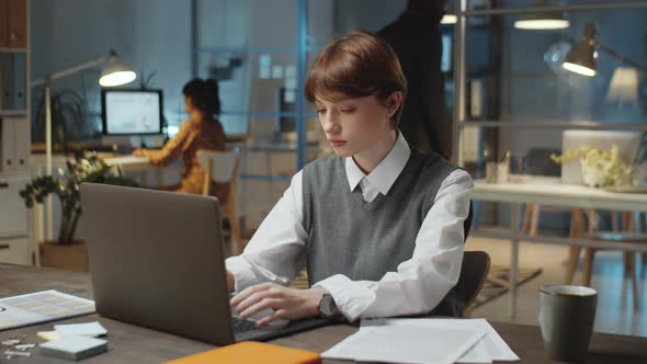 Young Businesswoman Working Late in Office