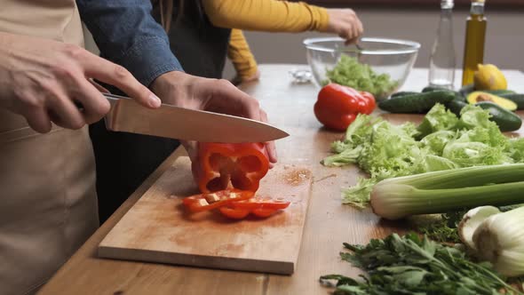 Cooking Salad at Home Man Hands Slicing Red Papper for a Salad