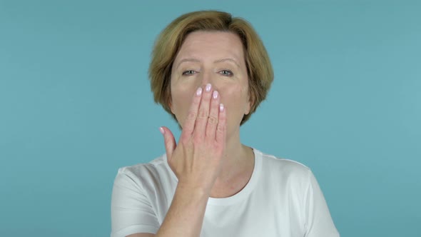 Flying Kiss By Old Woman Isolated on Blue Background