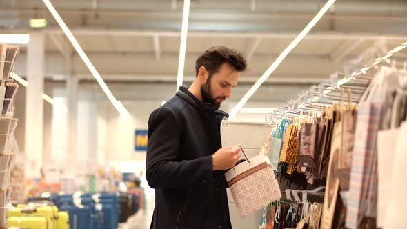 Man Shopping In Market.Businessman On Supermarket Choose Gift.Buyer Walking On Retail Shop.Purchaser