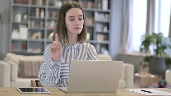 Attractive Young Woman Saying No By Finger in Loft Office