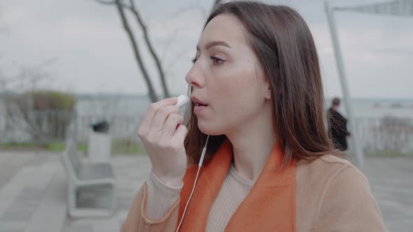 Young Female Holding Lipstick in Her Hands and Paints Lips Prepare Getting Ready in the Morning