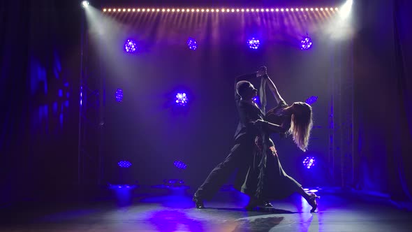 Light Waltz Movements Performed By a Lovely Pair of Dancers Take Center Stage. Slow Motion