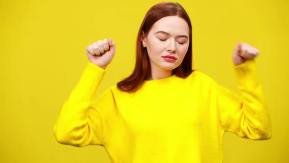 Active Dance of Slim Redhead Woman in Slow Motion at Yellow Background