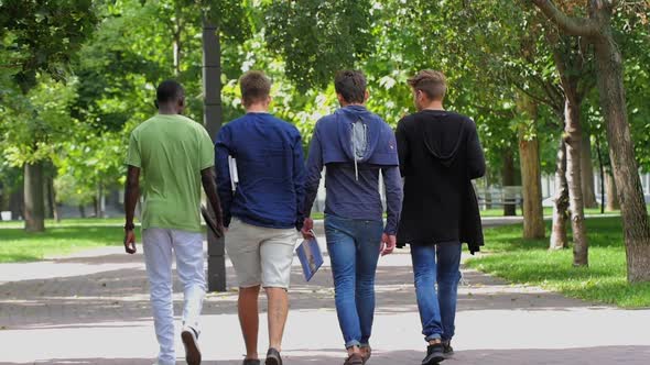 College of Students Walking Together on Campus. Slow Motion