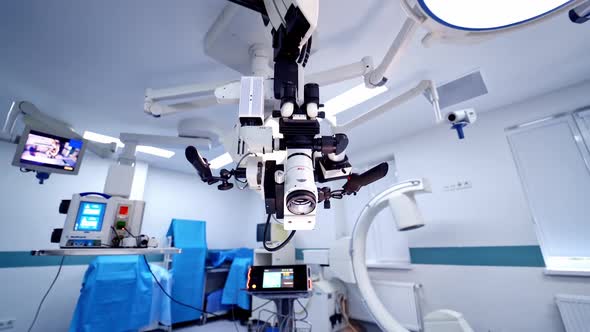 Innovative microscope inside the operating room. Empty surgery with modern medical equipment