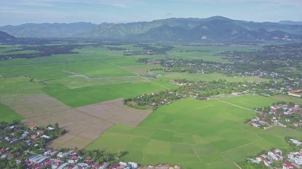 Drone Flies High Above Villages Rice Fields Against Hills