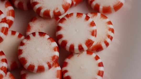 Rotating shot of peppermint candies - CANDY PEPPERMINT 052