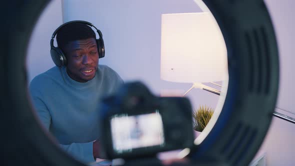 Camera Screen Showing A Man Wearing Headphones Talking While Looking At The Camera