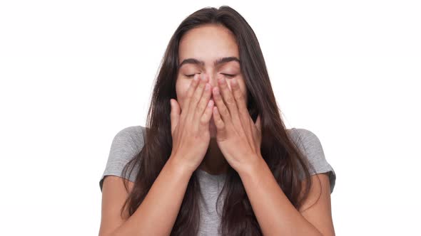 Portrait of Pretty Brunette Longhaired Woman Being Impressed Feeling Happy Covering Mouth with Hands