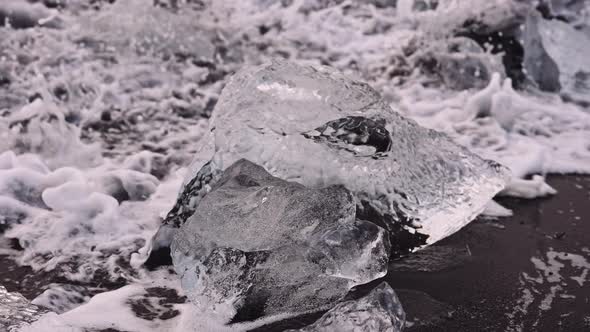 Waves Over Ice on Diamond Beach in Iceland