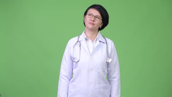 Beautiful Woman Doctor with Short Hair Thinking