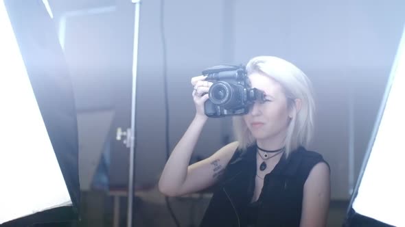Female Photographer Shooting at Studio
