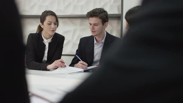 Young business people discussing in conference room