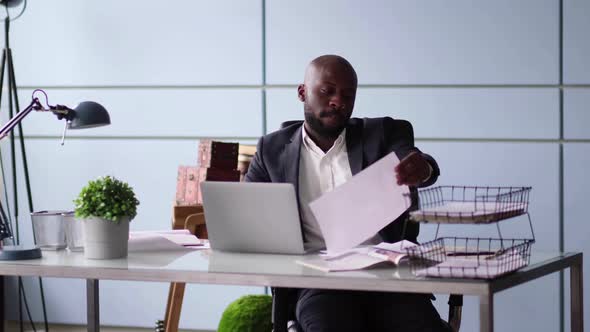 Photo of Handsome Employee Working in Office with Laptop in Front