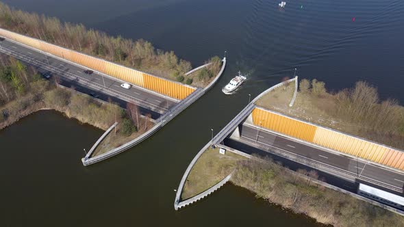 Veluwemeer Aqueduct view from above, boat sailing across aquaduct over traffic tunnel highway