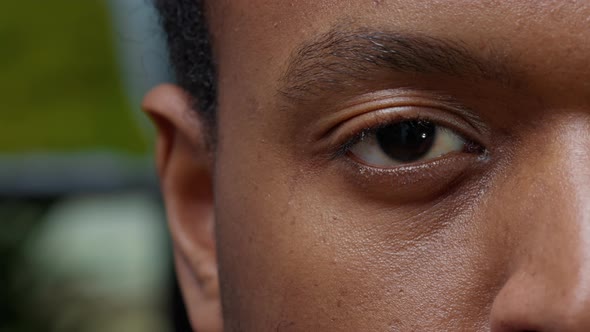 Macro Shot of Young Man Showing One Eye and Half of Face