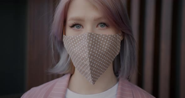 Closeup Portrait of Goodlooking Girl Student Wearing Fabric Face Mask Indoors