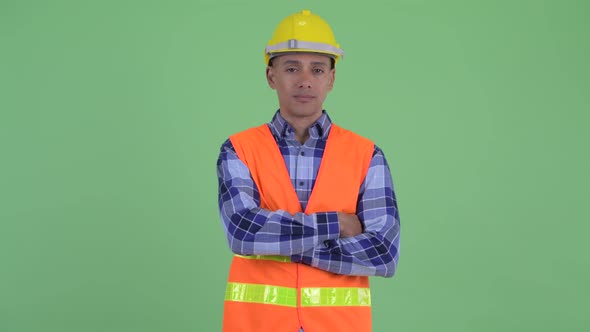 Happy Multi Ethnic Man Construction Worker Smiling with Arms Crossed