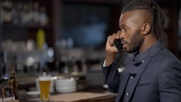 Nervous Confident Stressed African American Businessman Talking on Phone Hanging Up Drinking Beer in