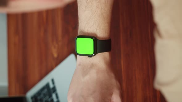 Vertical Video of Man Student Using Smartwatch with Chroma Key Closeup