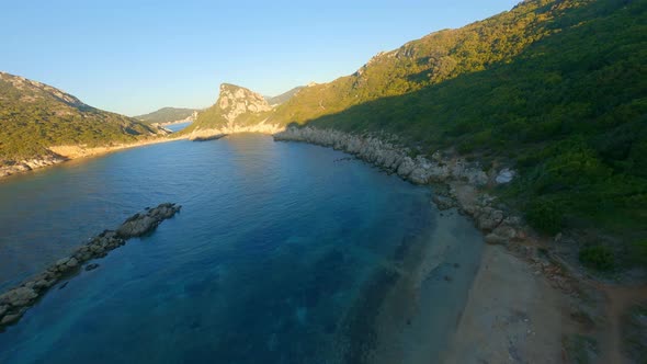 Drone Over Controller And Sunlit Corfu Landscape