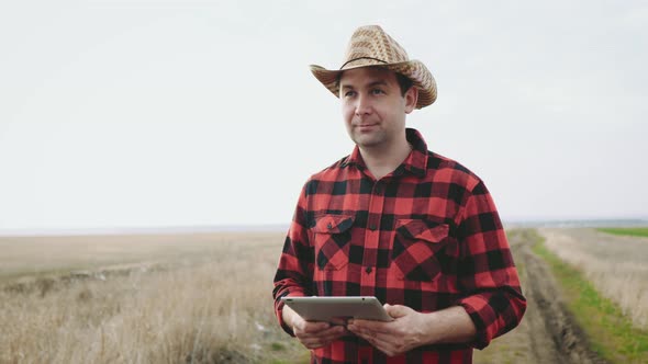 Smart Agriculture Technology Farmer Holding Tablet with Smart Technology