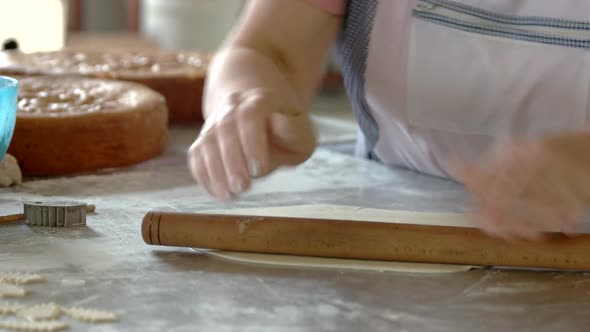 Baker Rolls the Dough with Rolling Pin