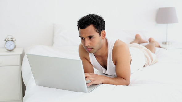 Handsome Man Using Laptop