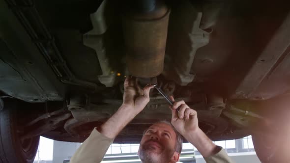 Mechanic servicing a car