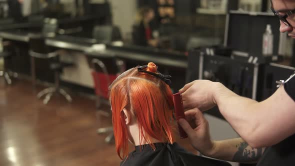 Young Woman Getting Her Hair Dressed in Hair Salon