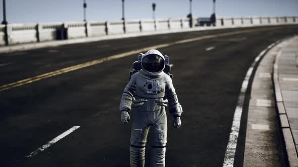 Astronaut in Space Suit on the Road Bridge alt