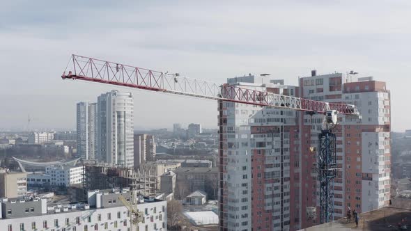 Aerial Shot of a Moving Construction Crane for Building a High-rise Building, Kharkov, Ukraine. A