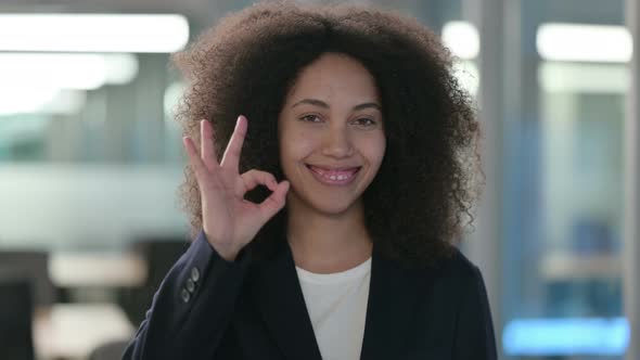 Portrait of Positive African Businesswoman Showing OK Sign