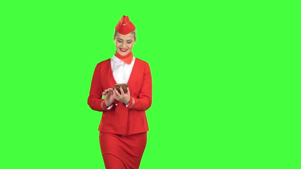 Woman with the Phone and Writes a Message . Green Screen
