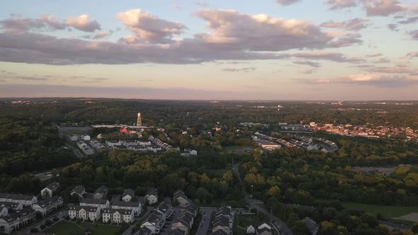 sunset drone shot over small town.