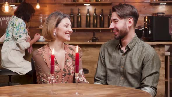 Young Beautiful Couple Clinking Glasses with Wine