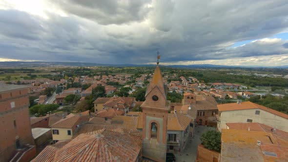 Drone Flying Above Roofs Towards The Church Of San Cristoforo (Bettolle) In Sinalunga, Italy - aeria