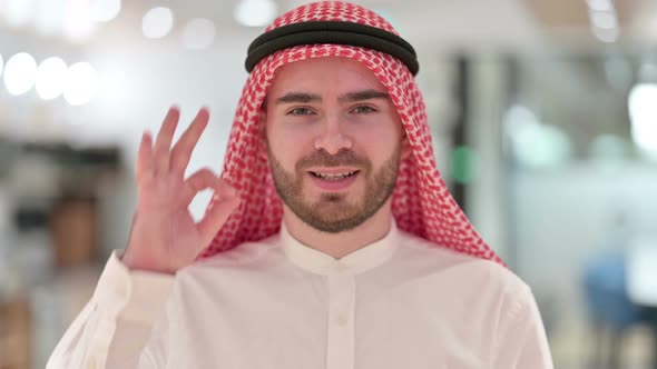 Portrait of Attractive Arab Businessman Showing Ok Sign with Hand