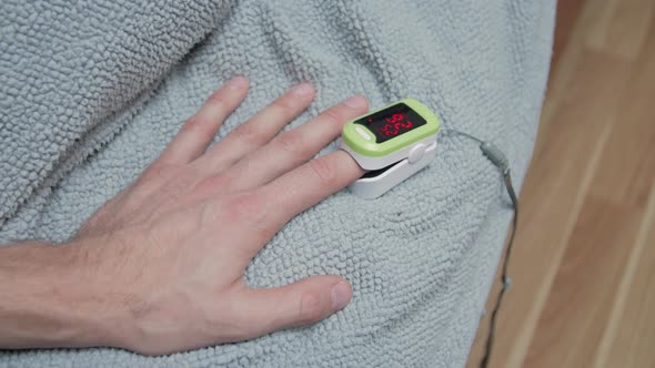 Man Hand Pulse Oximeter