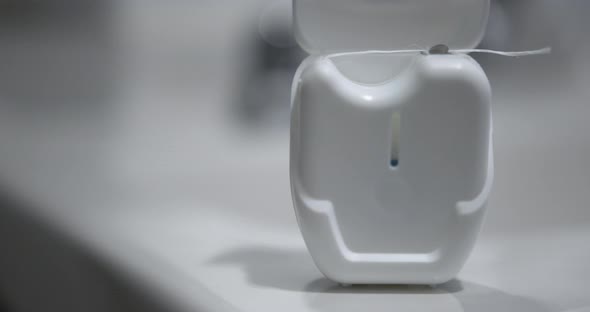 Close Up of Dental Floss on a Sink